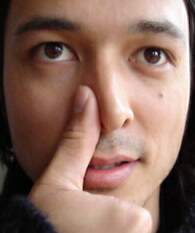 Stop a bloody nose using the thumbs up method